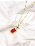 Beautiful Golden necklace with big Red Stone