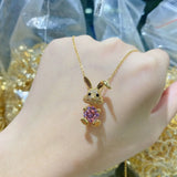 Stainless necklace of cute little golden bunny with pink stone